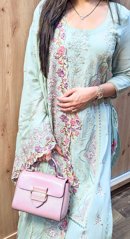 Light green machine work crepe suit