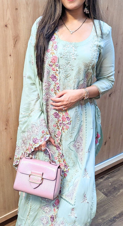 Light green machine work crepe suit 